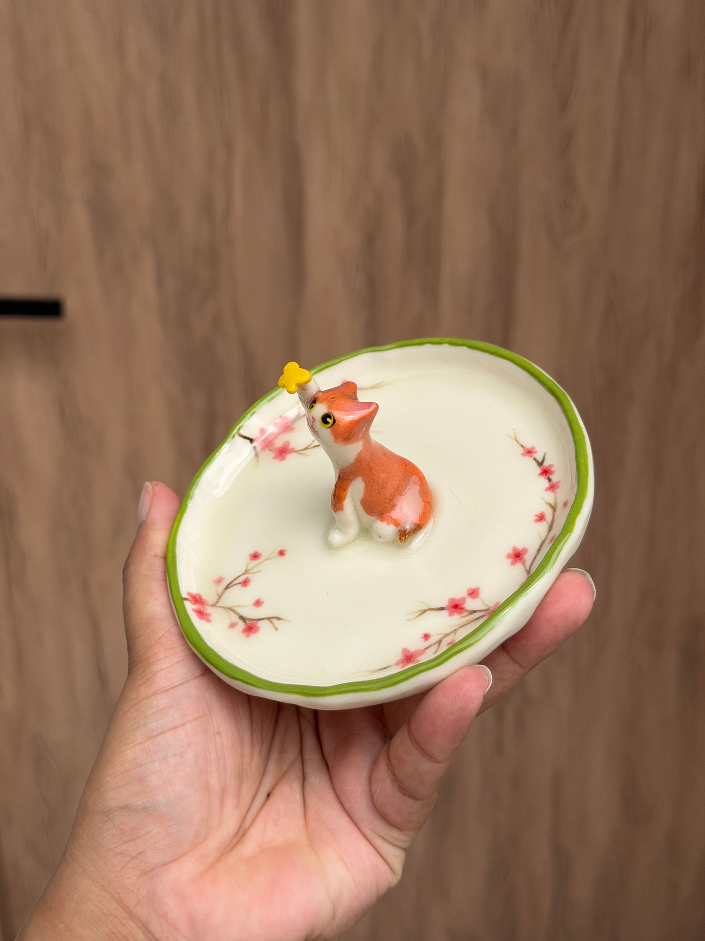 Orange cat sakura trinket