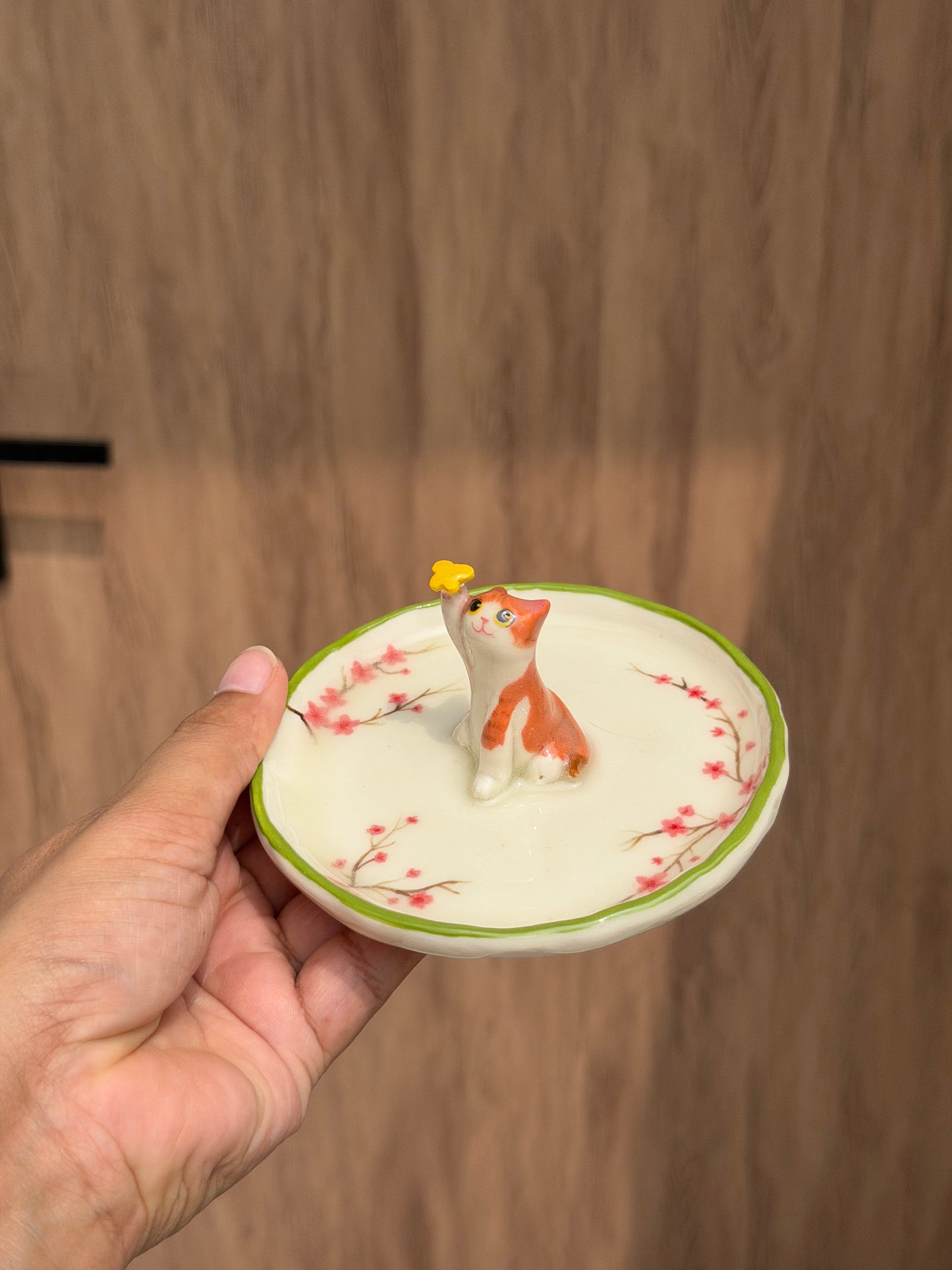 Orange cat sakura trinket