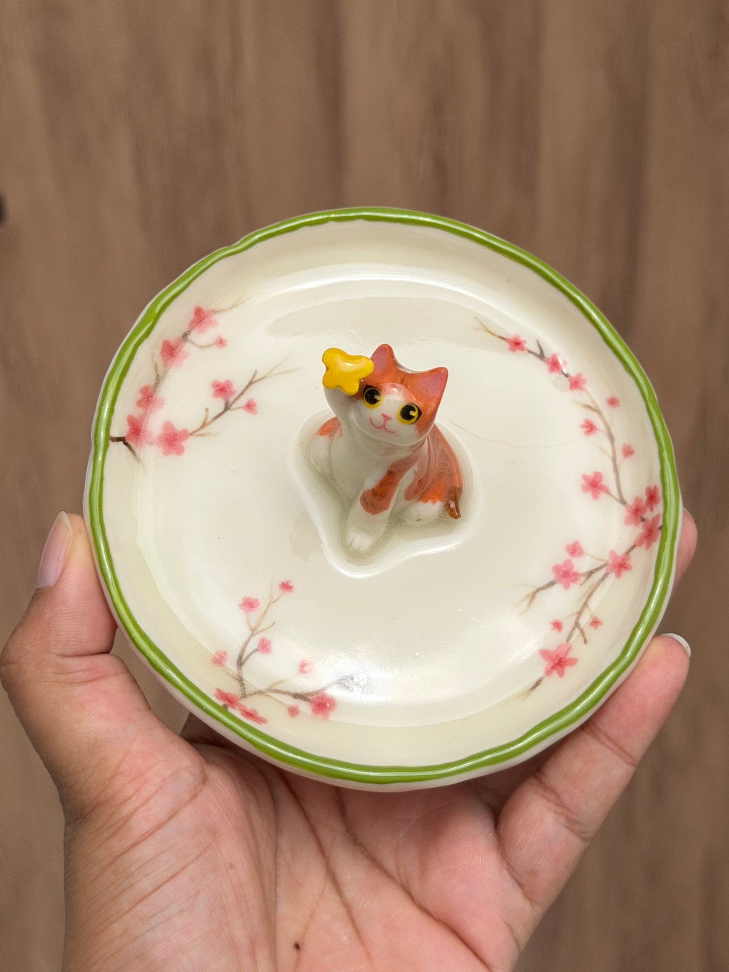 Orange cat sakura trinket