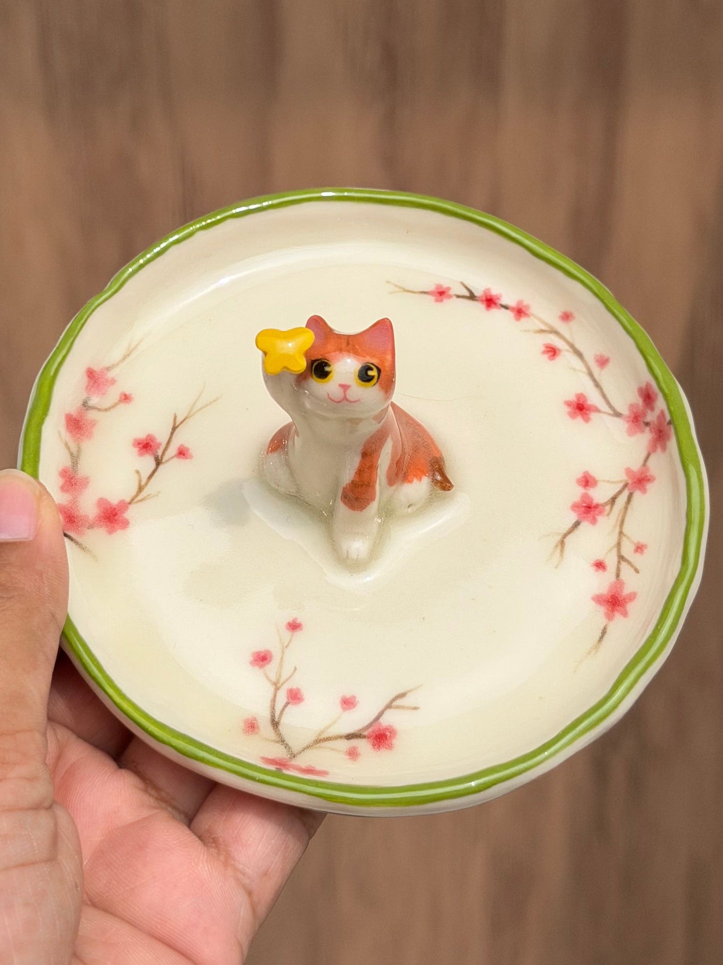 Orange cat sakura trinket