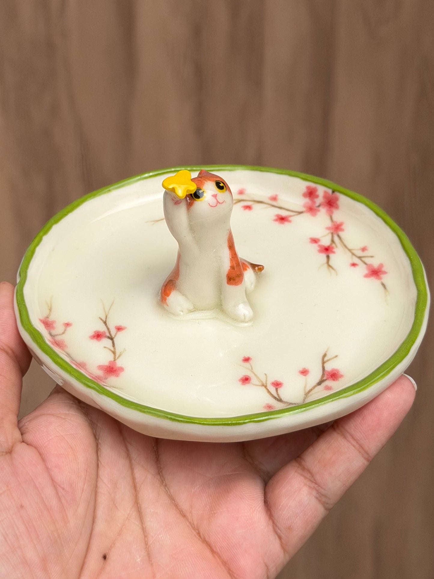 Orange cat sakura trinket